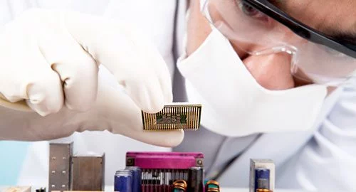 Scientist installing a CPU. Technology is one of the many applications for deuterium oxide